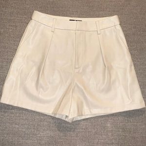 7 for all mankind faux leather cream shorts